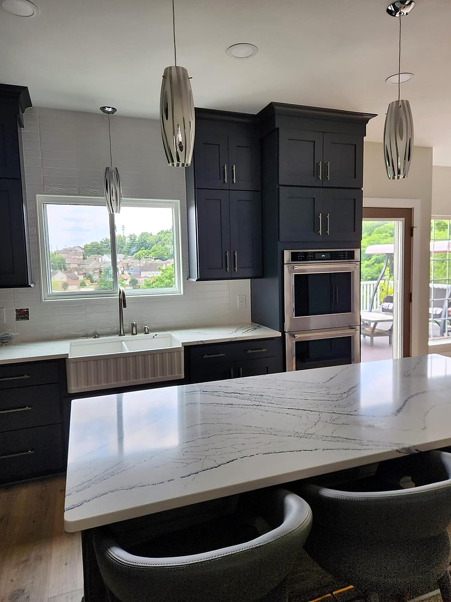Quartz-topped kitchen island with custom cabinetry